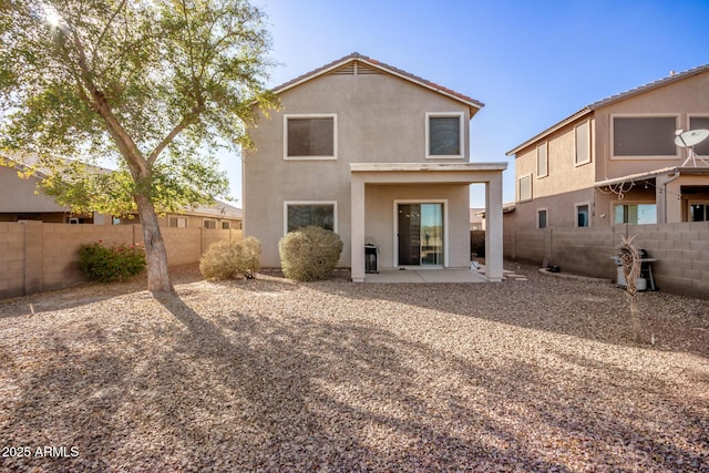 rear view of property with a patio area