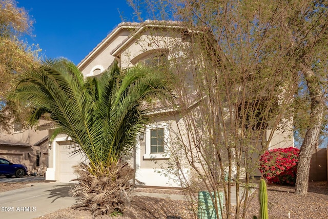 view of property exterior featuring a garage