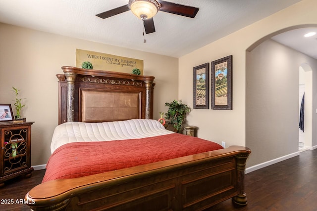 bedroom featuring ceiling fan and dark hardwood / wood-style floors