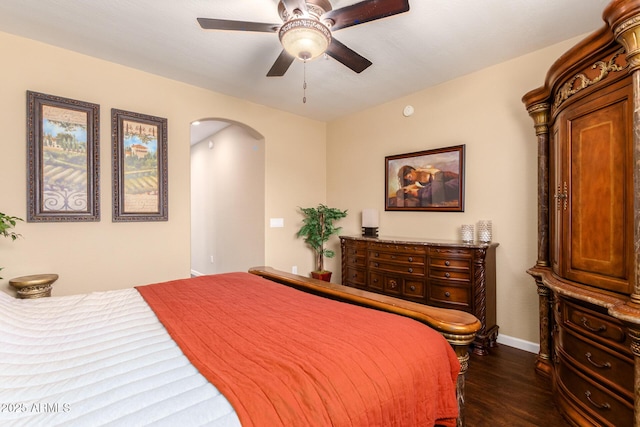 bedroom featuring ceiling fan and dark hardwood / wood-style flooring