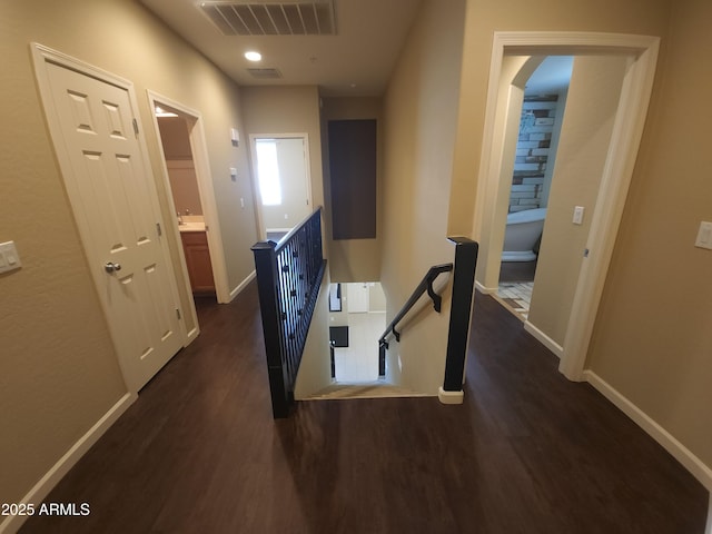 corridor with dark wood-type flooring