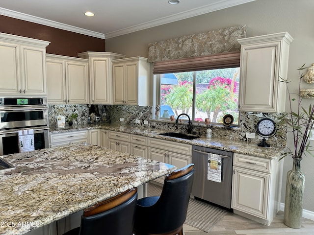 562 E Vesper Trl, Queen Creek, AZ 85140 - kitchen featuring appliances with stainless steel finishes, a sink, light stone counters, a kitchen breakfast bar, and decorative backsplash