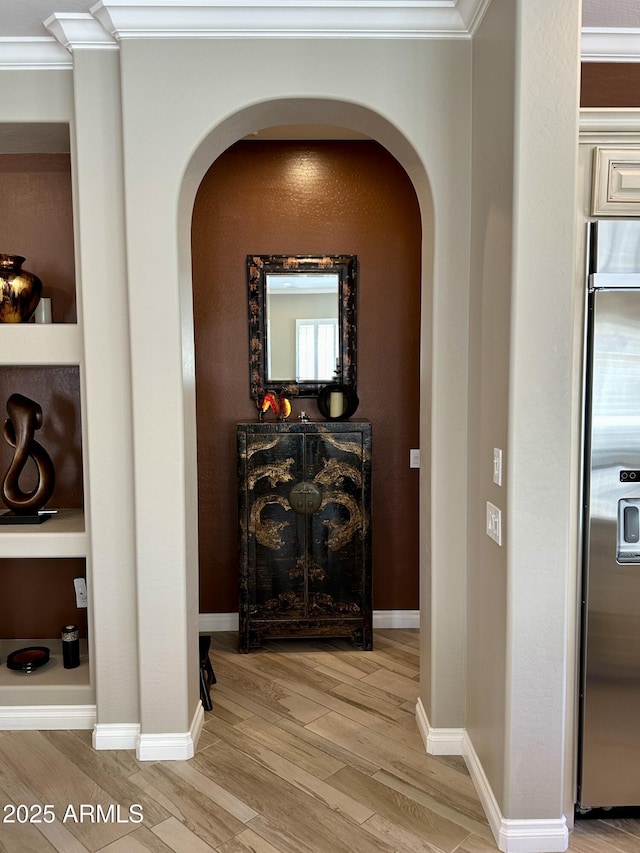 562 E Vesper Trl, Queen Creek, AZ 85140 - hall featuring arched walkways, ornamental molding, and light wood-style flooring