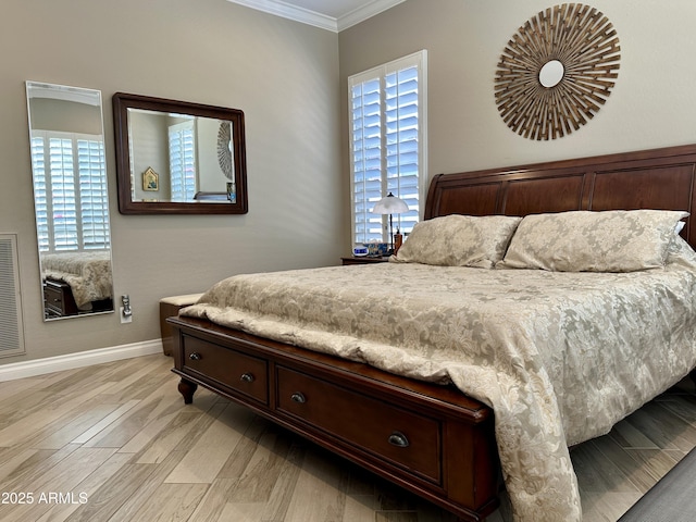 562 E Vesper Trl, Queen Creek, AZ 85140 - bedroom with crown molding, baseboards, and light wood-type flooring