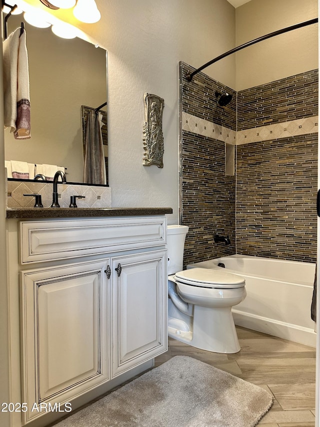 562 E Vesper Trl, Queen Creek, AZ 85140 - bathroom featuring wood finished floors, vanity, shower / tub combo, and toilet