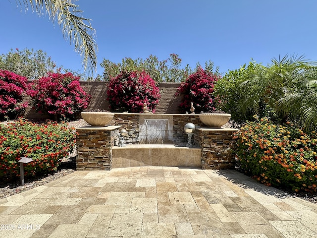 562 E Vesper Trl, Queen Creek, AZ 85140 - view of patio / terrace featuring a fireplace