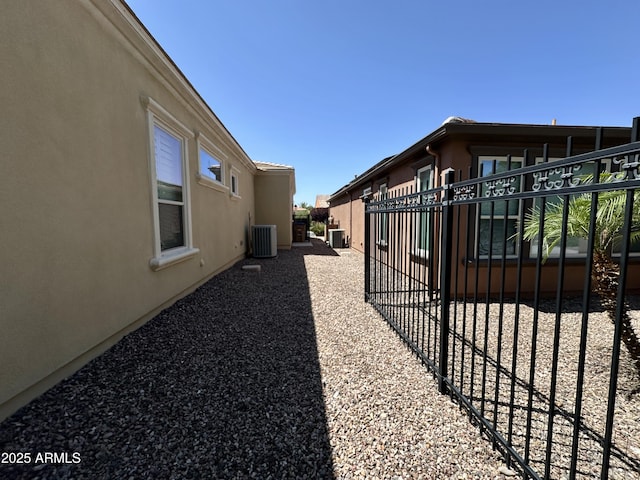 562 E Vesper Trl, Queen Creek, AZ 85140 - view of property exterior featuring central AC unit and stucco siding