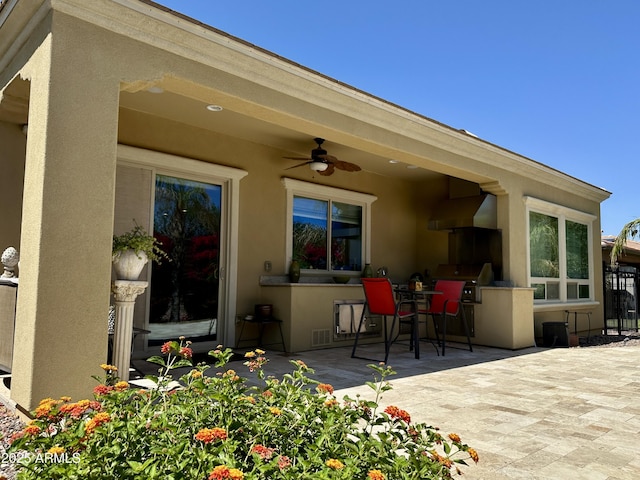 562 E Vesper Trl, Queen Creek, AZ 85140 - view of patio with a ceiling fan and exterior kitchen