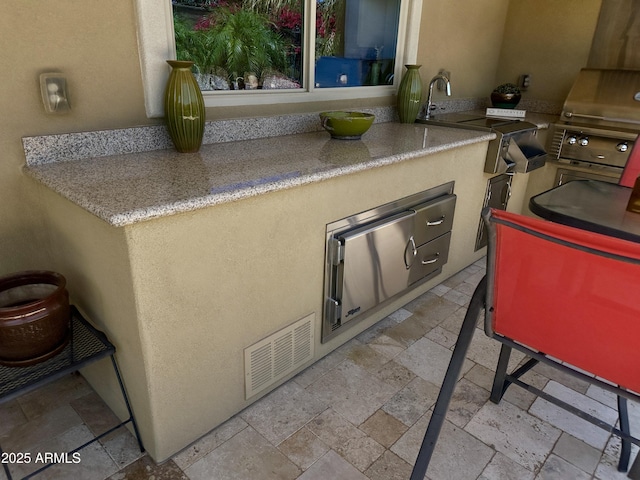 562 E Vesper Trl, Queen Creek, AZ 85140 - kitchen with stone tile flooring, a sink, and light countertops