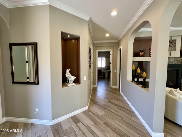 562 E Vesper Trl, Queen Creek, AZ 85140 - hall featuring light wood-style floors, ornamental molding, arched walkways, recessed lighting, and baseboards