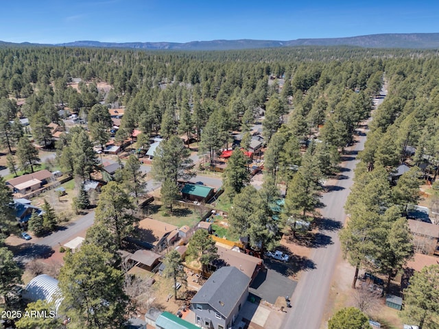 bird's eye view with a view of trees and a mountain view