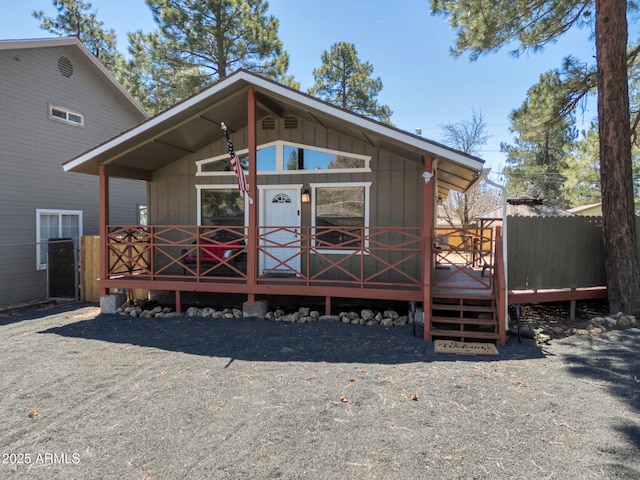 view of front of property with board and batten siding and a wooden deck