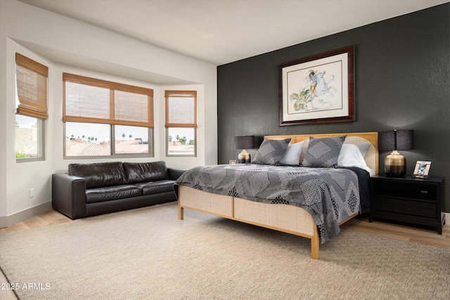 8068 E Del Trigo Rd, Scottsdale, AZ 85258 - bedroom featuring light wood-style floors and baseboards