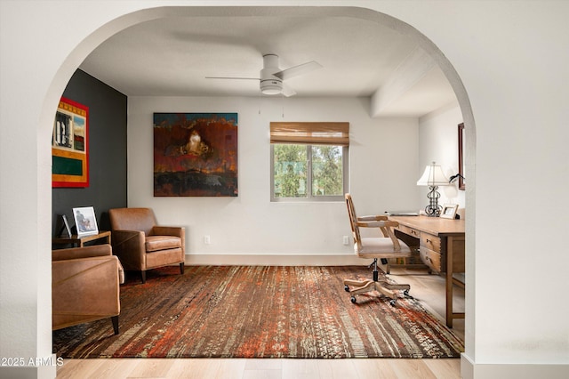 8068 E Del Trigo Rd, Scottsdale, AZ 85258 - office featuring a ceiling fan, wood finished floors, and arched walkways