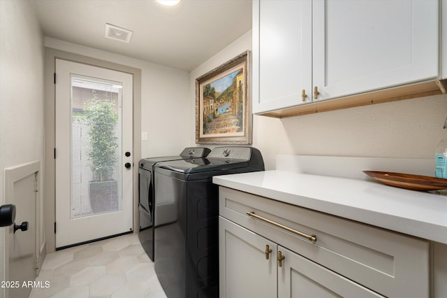 8068 E Del Trigo Rd, Scottsdale, AZ 85258 - laundry room with cabinet space and washer and clothes dryer