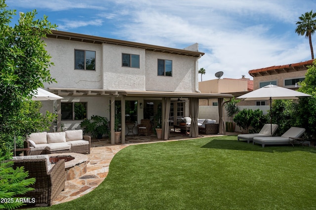 8068 E Del Trigo Rd, Scottsdale, AZ 85258 - back of property featuring an outdoor living space, a lawn, and a patio area