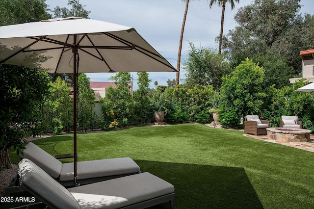 8068 E Del Trigo Rd, Scottsdale, AZ 85258 - view of green lawn with a fire pit