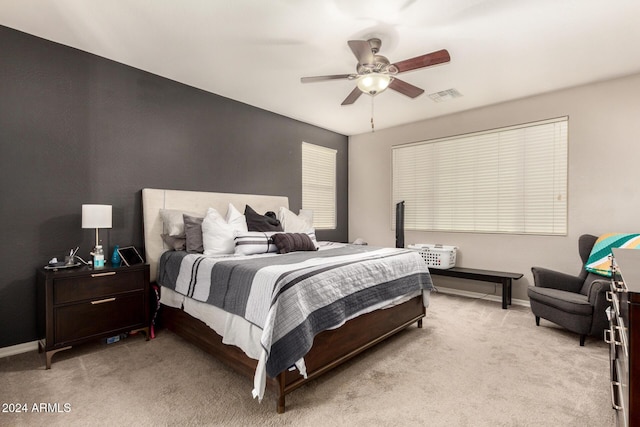 bedroom featuring ceiling fan and light colored carpet