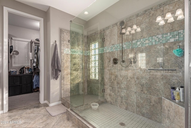 bathroom featuring tile patterned floors and walk in shower