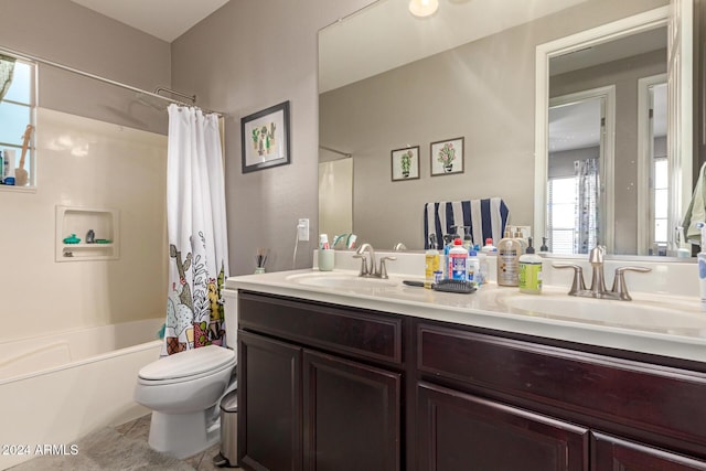 full bathroom featuring vanity, shower / tub combo, and toilet