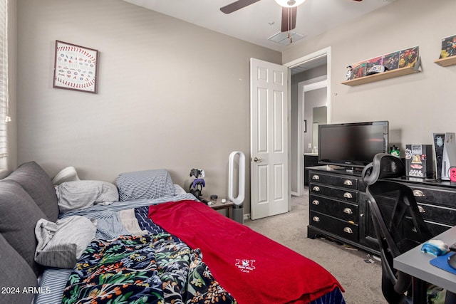 bedroom featuring ceiling fan and light colored carpet