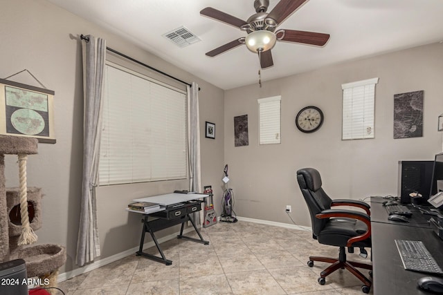 tiled home office with ceiling fan