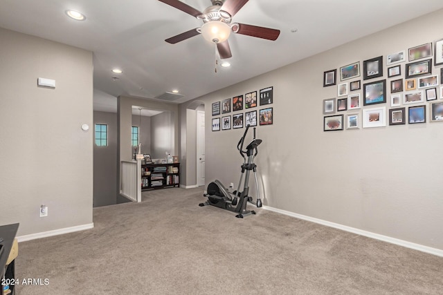 exercise area with carpet flooring and ceiling fan