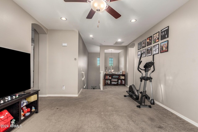 workout room featuring carpet floors and ceiling fan