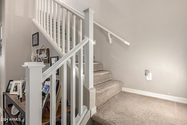 stairway with carpet floors