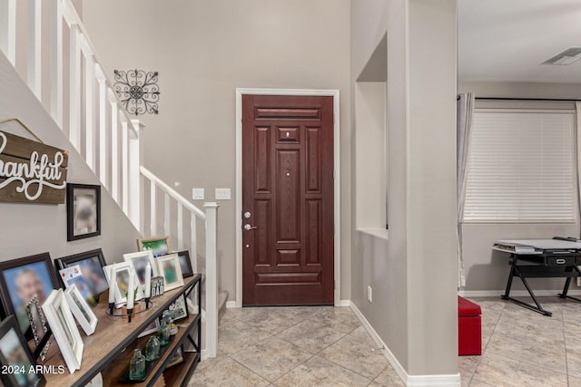 entrance foyer with light tile patterned floors