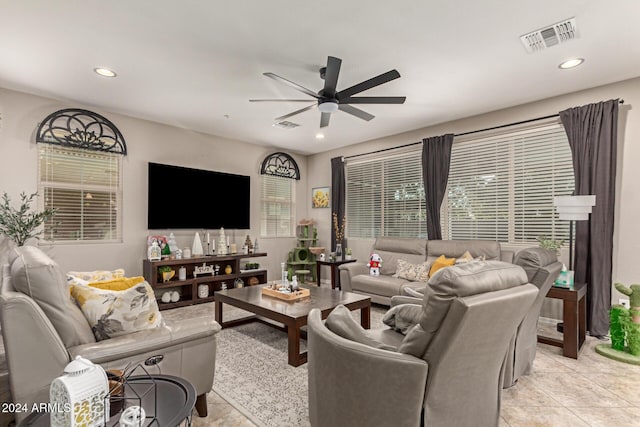 living room featuring ceiling fan and light tile patterned flooring