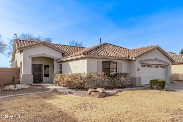 view of front of house featuring a garage and a front yard