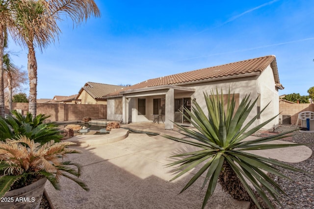 back of house featuring a patio