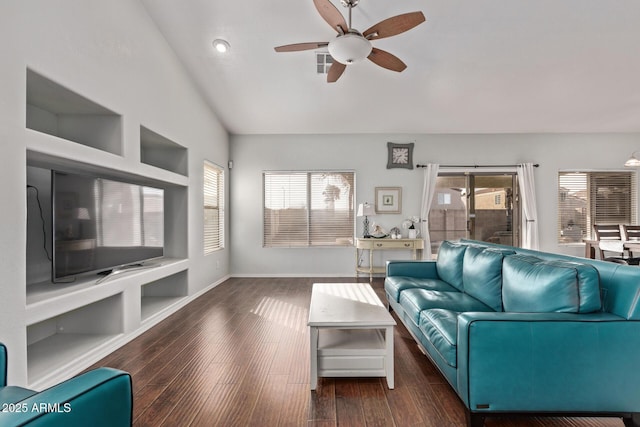 unfurnished living room featuring ceiling fan, lofted ceiling, and dark hardwood / wood-style flooring