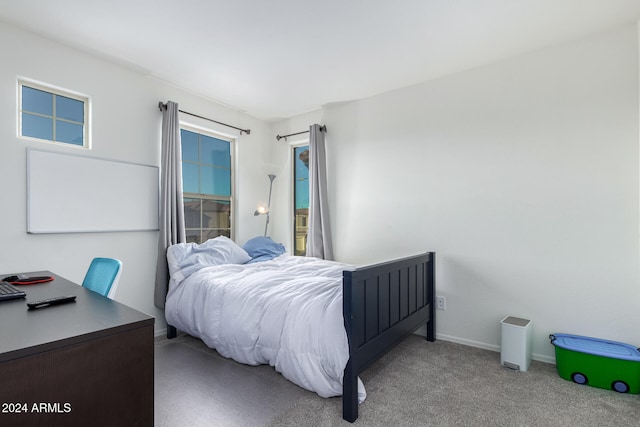 bedroom featuring light carpet