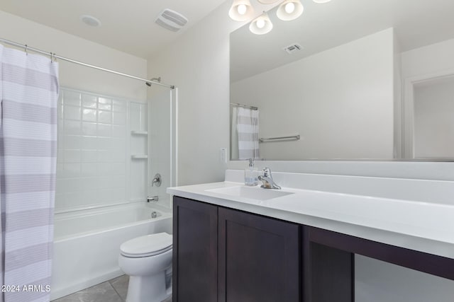 full bathroom featuring tile patterned floors, shower / bath combo with shower curtain, vanity, and toilet