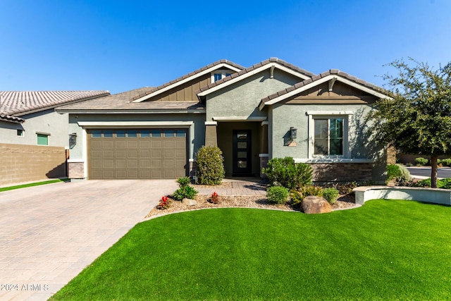 craftsman house with a garage and a front yard