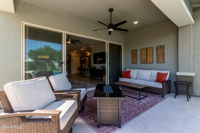 view of patio / terrace featuring ceiling fan and an outdoor living space