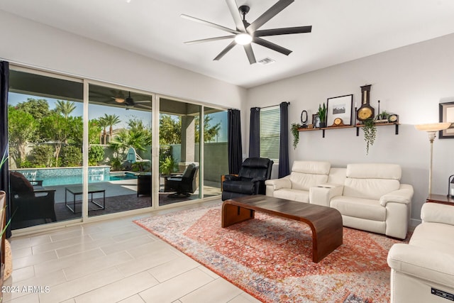 tiled living room featuring ceiling fan