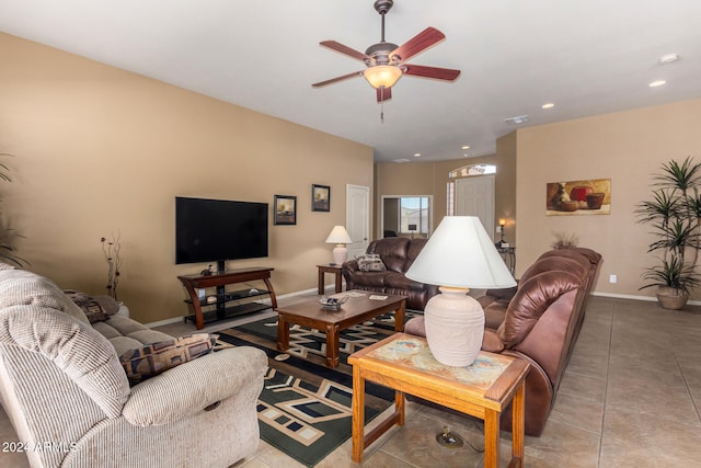 tiled living room with ceiling fan