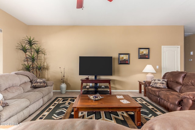 living room with carpet floors and ceiling fan