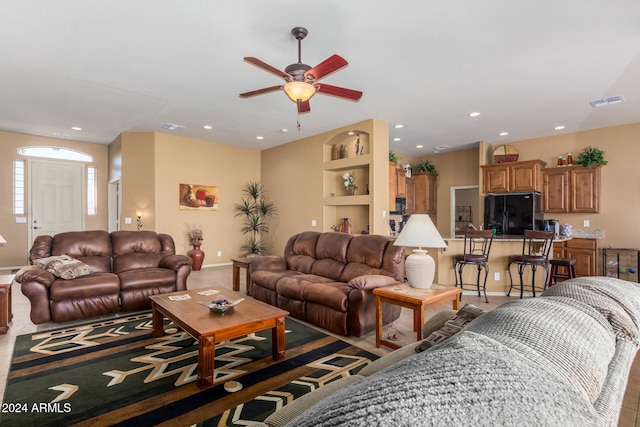 living room featuring ceiling fan