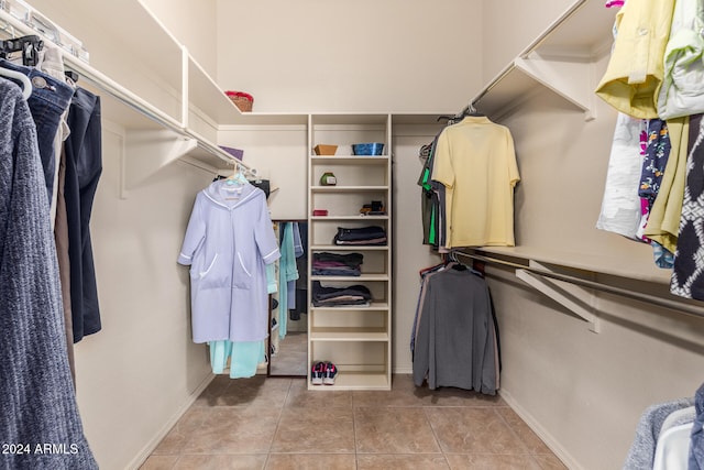 spacious closet featuring light tile patterned flooring