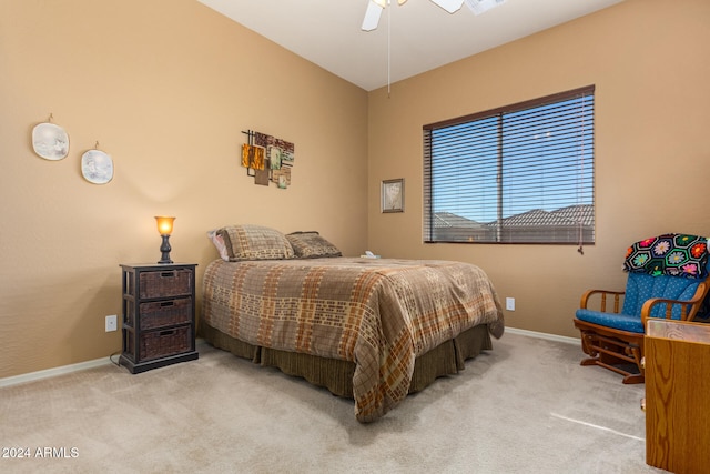 bedroom with light carpet and ceiling fan