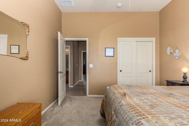 carpeted bedroom featuring a closet