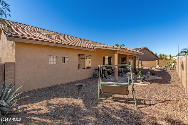 rear view of property with a patio