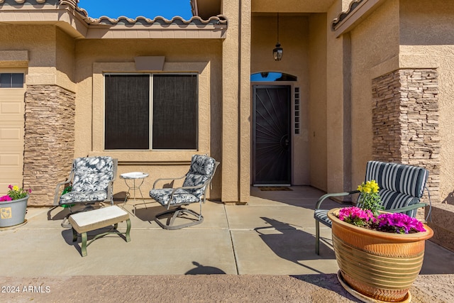 doorway to property with a patio