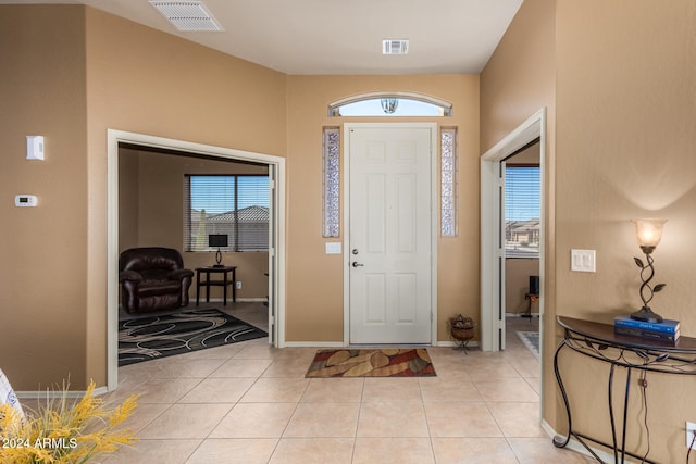 tiled foyer entrance featuring a wealth of natural light