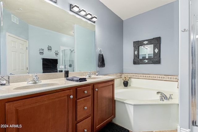 bathroom featuring double vanity, visible vents, a sink, a shower stall, and a bath