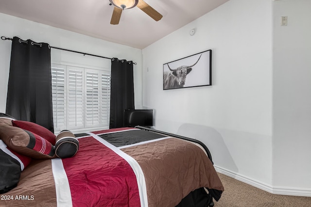 carpeted bedroom featuring a ceiling fan and baseboards